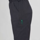 Side view of a person wearing dark shorts with a green zipper pocket.