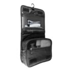 Black hanging toiletry bag with zipped mesh pockets holding bathroom essentials.