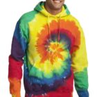 Person smiling in a colorful tie-dye hoodie with hands by side.
