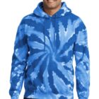 Smiling person wearing a blue tie-dye hoodie and jeans.
