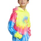 Child in a colorful tie-dye hoodie, hands in pockets, looking to the side.