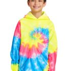 Smiling child in a colorful tie-dye hoodie and jeans.