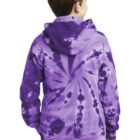 Child wearing a purple tie-dye hoodie and jeans, facing away.
