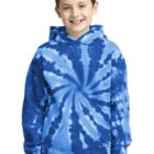 Smiling child wearing a blue tie-dye hoodie, standing against a plain white background.