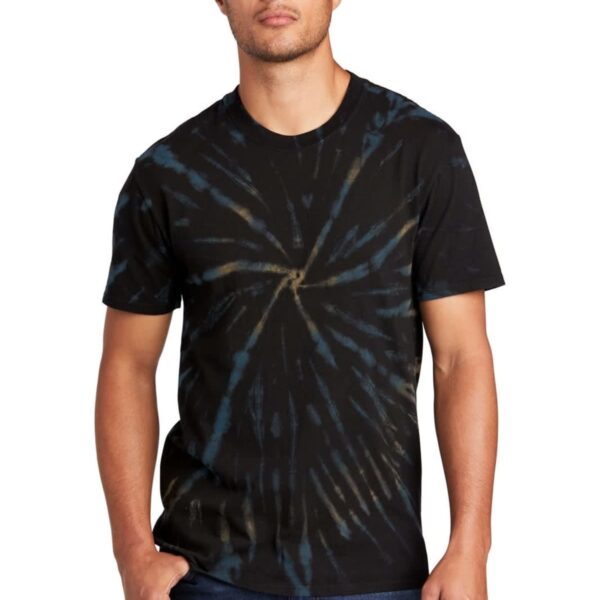 Man wearing a black tie-dye t-shirt and jeans, standing against a white background.