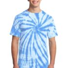 Man wearing a blue tie-dye T-shirt and jeans, smiling.