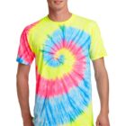Person wearing a colorful tie-dye T-shirt with jeans, smiling.