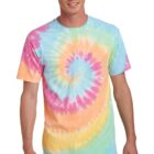 Person wearing a colorful tie-dye T-shirt and jeans, smiling at the camera.
