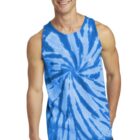 Person in a blue tie-dye tank top smiles, standing against a white background.