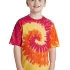 Boy wearing a spiral tie-dye shirt in red, orange, and yellow, smiling.