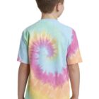 Boy wearing a colorful tie-dye shirt with spiral pattern, facing away.