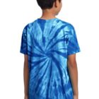 Rear view of person wearing a blue tie-dye T-shirt and dark jeans.
