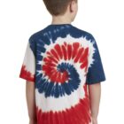 Boy in a red, blue, and white tie-dye shirt facing away.