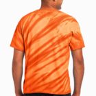 Person wearing an orange tie-dye shirt and jeans, viewed from the back.
