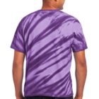 Person wearing a purple tie-dye T-shirt and jeans, viewed from the back.