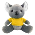 Gray koala plush toy wearing a yellow t-shirt, sitting upright against a white background.