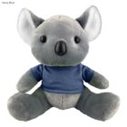 Plush koala toy wearing a navy blue shirt, sitting upright facing forward.