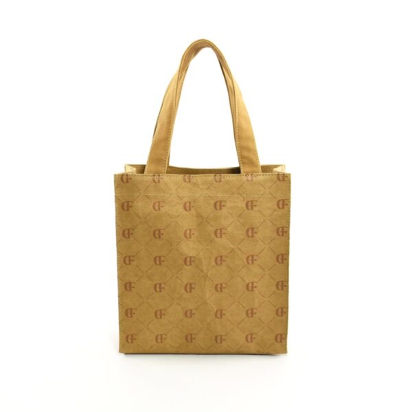 Tan tote bag with patterned design and two handles, shown on a plain white background.