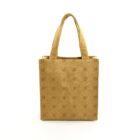 Tan tote bag with short handles and a repeating monogram pattern on the front.