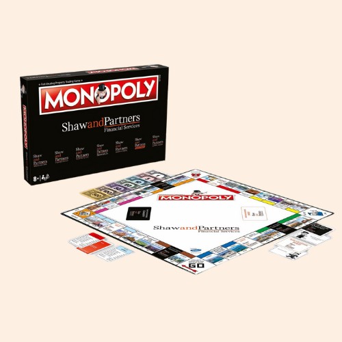 Monopoly board game set with Shaw and Partners branding on a light background.