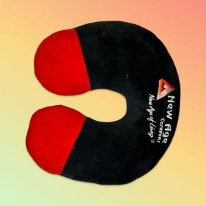 Black and red U-shaped travel neck pillow embroidered with the New Age Caravans logo