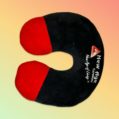 Black and red neck pillow with New Age logo on a gradient background.