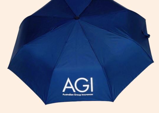 Blue umbrella with AGI and Australian Group Insurances printed on it.