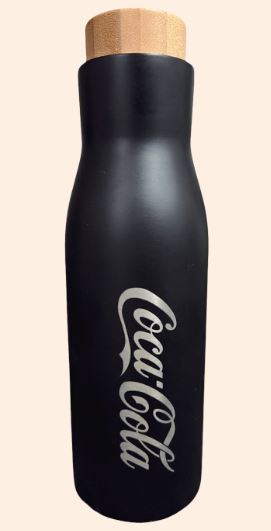 Black bottle with wooden lid, featuring Coca-Cola logo.