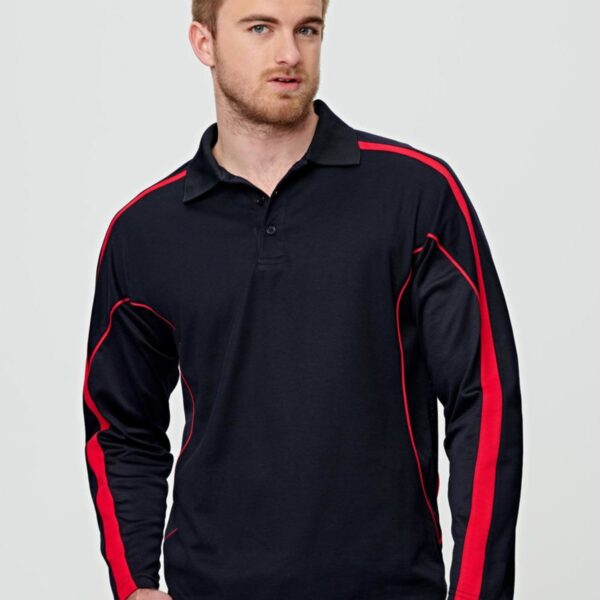 Man in a black long-sleeve polo shirt with red accents, standing against a light background.
