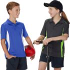 Two kids in sportswear chatting; one holds a red ball, the other a pump.