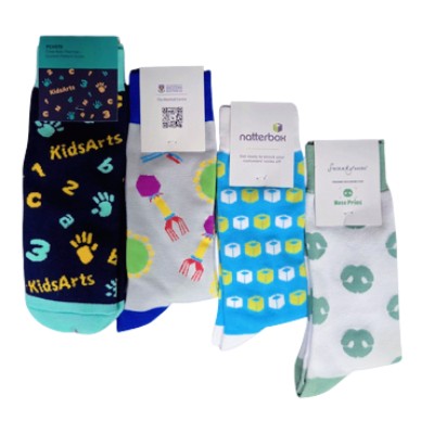 Four pairs of colorful, patterned socks showcasing different types on a white background.