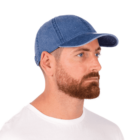 Man with a beard wearing a blue denim cap and white shirt, looking to the right.