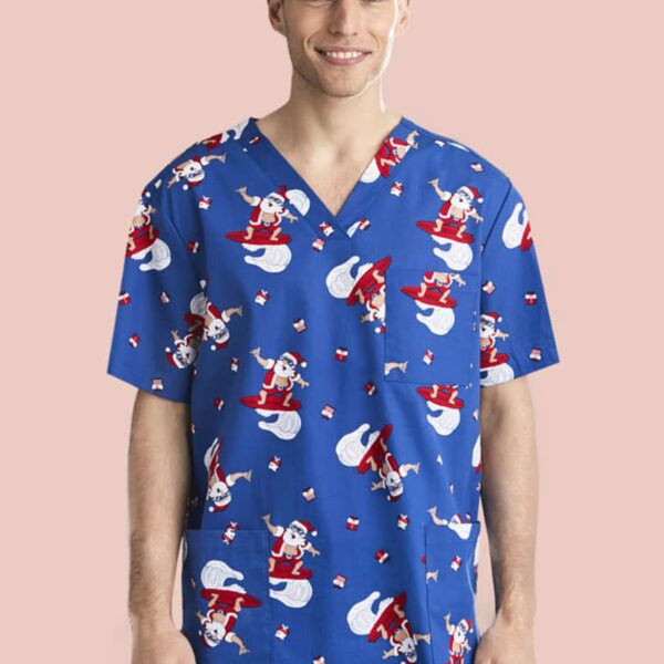 Person wearing a blue scrubs top with Santa print, smiling against a pink background.