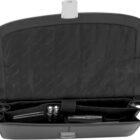 Open black leather bag with compartments holding pens, a flashlight, and other small items.