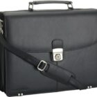 Black leather briefcase with a shoulder strap and a silver buckle on the front.