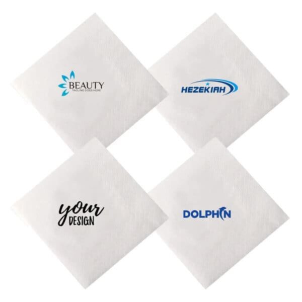 Four white napkins each with a different printed logo or design in the center.