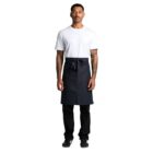 Man in white t-shirt, black apron, and black pants standing against a white background.