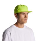 Man wearing a neon yellow cap and white shirt against a plain white background.