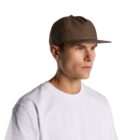 Man in a white t-shirt wearing a brown baseball cap, looking to the side.