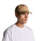 Person in a beige baseball cap and white t-shirt looking to the side against a white background.