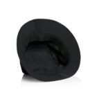 Black bucket hat turned upside down on a white background.