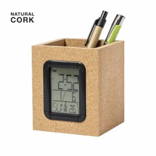 A cork pen holder with a digital clock and two pens inside.