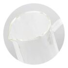 Clear glass pitcher with a handle, viewed from above on a light gray background.