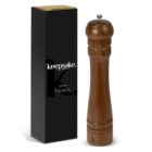 Tall wooden pepper mill next to a black keepsake collection box on a white background.