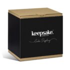 Brown and black box labeled keepsake collection Cake Display on the front.
