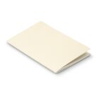 A small, blank, folded booklet with an off-white cover, lying on a white surface.