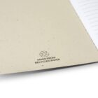 Notebook made from recycled paper with an open page showing the recycling symbol.