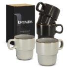 Four stackable mugs, two black and two white, beside a black Keepsake Collection box.