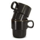 Three stacked black ceramic mugs with handles, set against a white background.