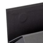 A close-up of a black folder with a faint circular mark on its surface.